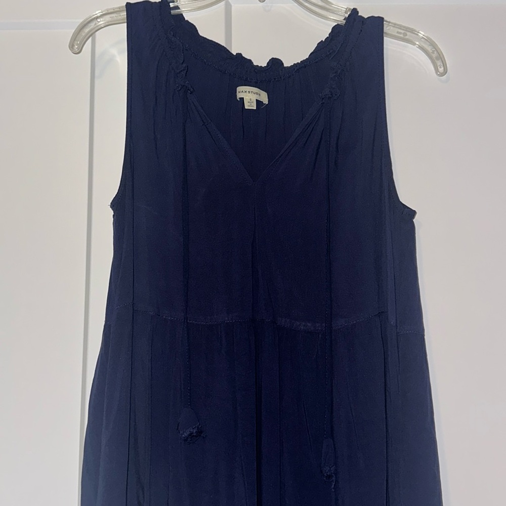 Navy blue loose fitting dress with pockets.
